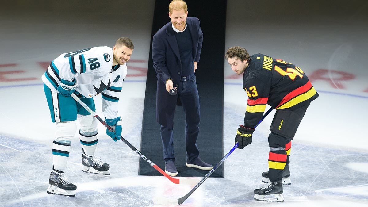 taylor-alert-–-body-language-expert-claims-prince-harry’s-‘playful’-puck-drop-is-a-sign-‘the-old-duke’-is-back-as-he-flashes-‘devilish-grin’-and-gives-his-‘own-version-of-a-royal-wave’…-but-he-might-like-to-pick-up-some-celebrity-cues-from-meghan