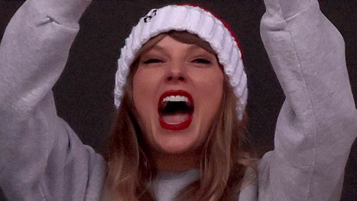 taylor-alert-–-taylor-swift-wears-her-heart-on-her-sweatshirt-in-kansas-city-chiefs-merch-while-cheering-lover-travis-kelce’s-win…-and-even-picks-up-new-bestie-brittany-mahomes-in-giddy-celebration