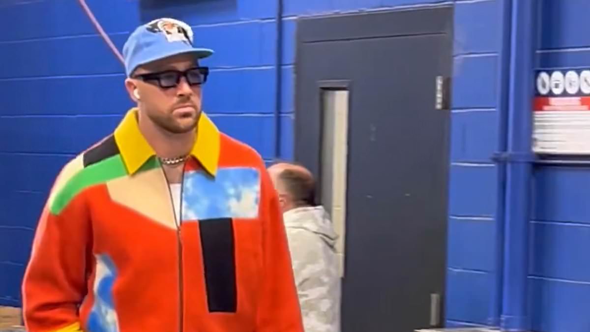 taylor-alert-–-travis-kelce-dons-bold-$4,200-patchwork-jacket-as-he-arrives-for-chiefs-bills…-and-fans-wait-to-see-if-taylor-swift-will-follow