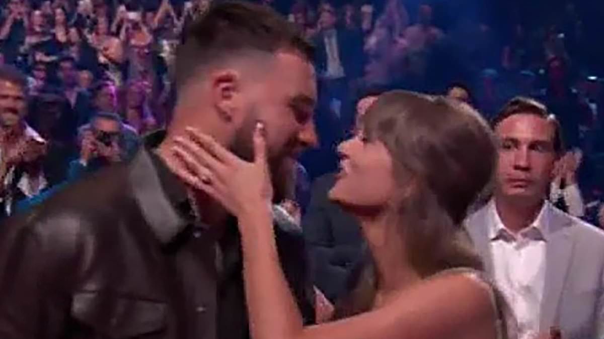taylor-swift-alerts-–-taylor-swift-sings-‘where-is-my-husband?’-to-travis-kelce-as-she-flashes-her-engagement-ring-during-raye’s-iheartradio-music-awards-performance